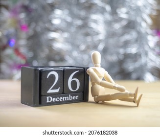 Manakin Leaning Against A Wooden Block  Date 26 December  Thinking That  The Boxing Day, The Shopping Day After Christmas Day.