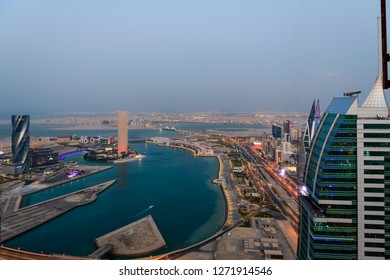 MANAMA, BAHRAIN - DECEMBER 15, 2018: Beautiful view of Bahrain Bay with illuminated buildings during sunset, Manama, Bahrain.