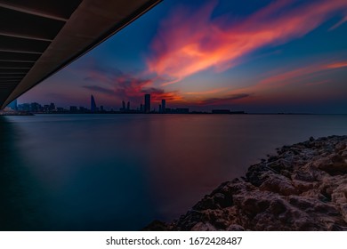 Manama, Bahrain - Feb 23 2020 : Beautiful blue hour view of Manama cityscape from Muharraq bridge