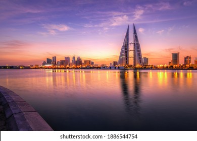 MANAMA, BAHRAIN - JANUARY 03, 2021: Skyline of Manama city dominated by Bahrain World trade Center building during sunrise with beautiful clouds and colours, Bahrain.