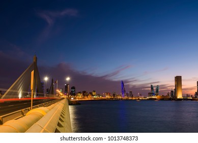MANAMA , BAHRAIN - January 30: View from Sheikh Isa bin Salman Causeway Bridge of Tallest iconic buildings of Bahrain bay at sunset blue hour , Manama, Bahrain on January 30, 2018.