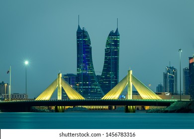 MANAMA, BAHRAIN - JULY 19, 2019: Beautiful view of iconic buildings Bahrain Financial Harbour and Shaikh Isa Bin Salman Causeway Bridge at blue hour after sunset, Manama, Bahrain