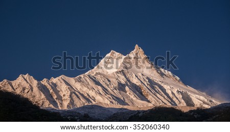 Manaslu mountain as viewed in its full glory at sunrise from a small Tibetan village of Samagaon, located on the trail of the famous Around Manaslu trek, Manaslu Himal, Nepalese Himalyas, Nepal  