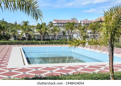 Manavgat, Turkey, 03.17.2021 - Large, Dirty Pool With Drained Water Prepared For Cleaning. Pool Maintenance Service.