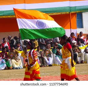 Manbazar, West Bengal / India - 26th January 2018 : Indian Under Privileged Tribal School Girls Holding And Waving National Flag And Performing Dance At Republic Day Parade And Celebration