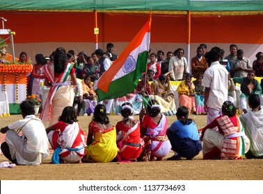 Manbazar, West Bengal / India - 26th January 2018 : Indian Under Privileged Tribal School Girls Holding And Waving National Flag And Performing Dance At Republic Day Parade And Celebration