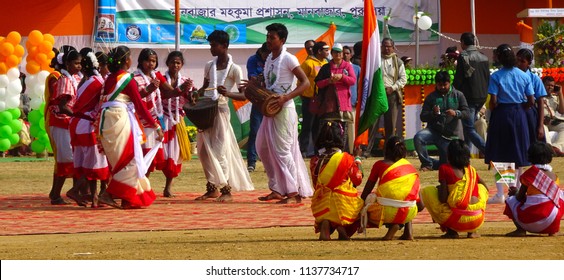 Manbazar, West Bengal / India - 26th January 2018 : Indian Under Privileged Tribal School Girls Holding And Waving National Flag And Performing Dance At Republic Day Parade And Celebration