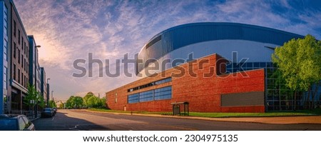 Manchester city skyline with circular geometry of the civic auditorium building with a cloudy sky, modern metropolitan architecture in New Hampshire