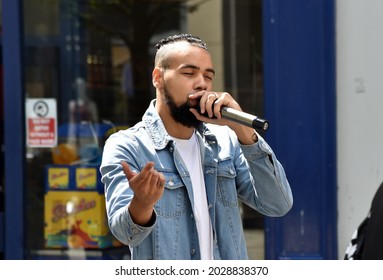 Manchester, England - July 7th 2021: Gamma Man performs busking in Central Manchester's Market Street.