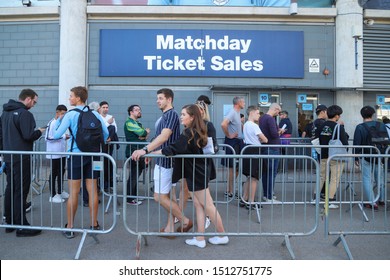 MANCHESTER, ENGLAND - SEPTEMBER 21, 2019: People Queuing At Ticket Office Outside Etihad Stadium In Manchester, England