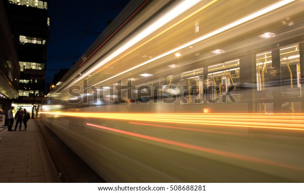 Manchester,
England - September 23, 2016: Manchester metrolink  trams traveling
with speed with passengers  near Piccadilly central bus and metro
station  at the city of Manchester in
England