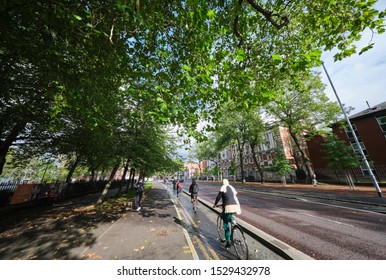 Manchester, England, UK - 10/09/2019: University Students Using Cycle Lane, Opposite St. Marys Hospital (NHS) Buildings, Oxford Road Manchester (UK)