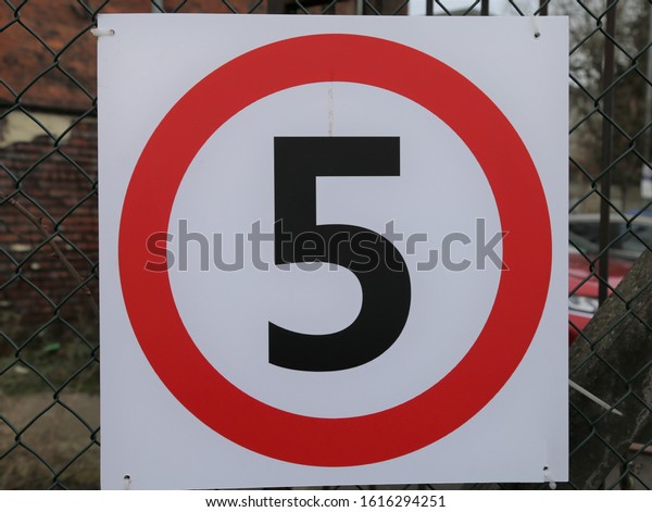 Manchester,\
England, UK.  January 13, 2020.  A close up view of a 5 mile per\
hour sign at the entrance to a car\
park.