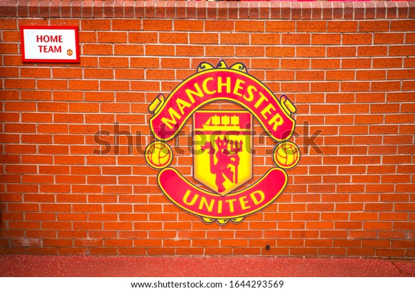 Manchester, England, UK - March 22, 2019 - Wall with symbol of Manchester United FC in the Old Trafford