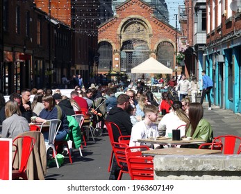 MANCHESTER. GREATER MANCHESTER. ENGLAND. 04-15-21.
Edge Street In The City's Northern Quarter. Tables Arranged Outdoors To Enable Social Distancing To Be Maintained As The Lockdown Restrictions Ease.