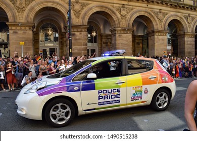 Manchester Greater Manchester UK August 24 2019 Pride Parade Passing In Front Of Radisson Hotel On Peter Street Police Car Bearing Police With Pride  Hate Crime Logo And Bee