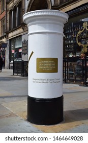 Manchester, Greater Manchester, UK. July 29, 2019. White Post Box Next To Town Hall Celebrating ICC Cricket World Cup Wins Of Both Men's And Women's Team In 2019 And 2017. Gold Plaque And Coffee Bar