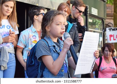 Manchester Greater Manchester UK September 20 2019 Youth Strike For Climate At St Peter's Square 10 Year Old School Girl Lillia From Oldham  Talks To Crowd On A Stage With Protesters In The Background