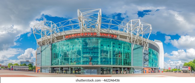 MANCHESTER - MAY 22:  Panoramic view with perspective distortion of front side of Old Trafford Football stadium in Manchester city, England, was taken on May 22, 2016, under cloudy blue sky.