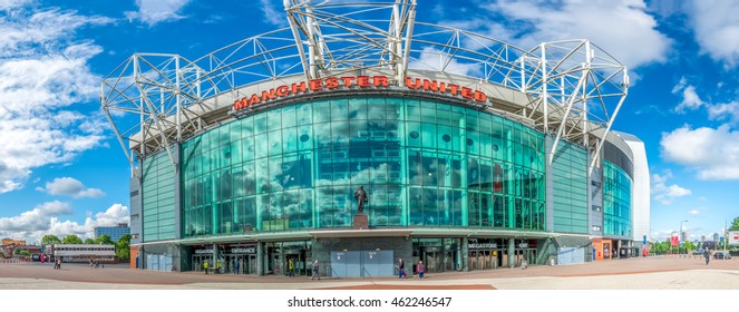 MANCHESTER - MAY 22:  Panoramic view with perspective distortion of front side of Old Trafford Football stadium in Manchester city, England, was taken on May 22, 2016, under cloudy blue sky.