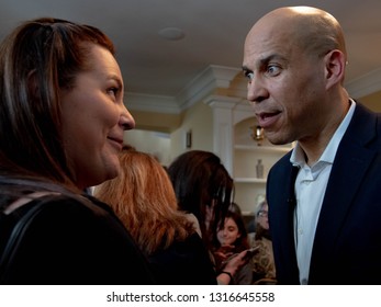 Manchester, N.H./USA - Feb. 17, 2019: U.S. Sen. Corey Booker, D-N.J., Speaks To A Voter At A House Party During His First Weekend Visit To New Hampshire As A Presidential Candidate.