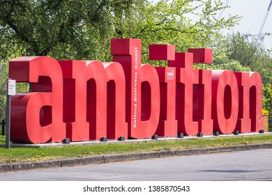 Manchester, UK 04/20/2019 Bright And Bold Ambition Sign In A Deep Red Colour. A Motivational And Inspirational Word For All To See In The Public. 