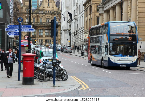 MANCHESTER, UK -\
APRIL 22, 2013: People ride Stagecoach city bus in Manchester, UK.\
Stagecoach Group has 16 percent bus market in the UK. Stagecoach UK\
employs 18,000\
people.