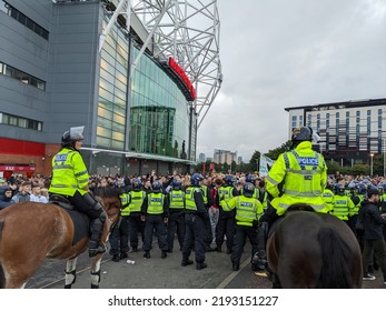 Manchester, UK. August 22, 2022. Protest March At Manchester United Against Glazer Owners. Large Crowd.  Sign Text United . `Green Smoke. Match Against Liverpool United.