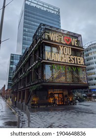 Manchester, UK, January 16, 2021. The Ivy restaurant, Spinningfields closed during the national lockdown in England with text We Love You Manchester above entrance.