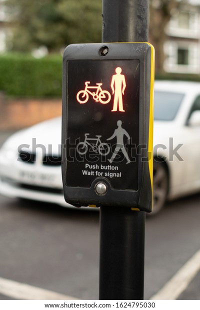 Manchester UK, January 21, 2019.\
Toucan (Two can) controlled crossing for bicycles and pedestrians\
with symbol do not cross illuminated. Shallow depth of\
field.