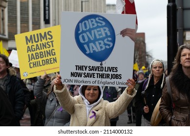 Manchester UK. January 22, 2022. Anti Vax Protest Deansgate. Protester Holding Banner Text Jobs Over Jabs