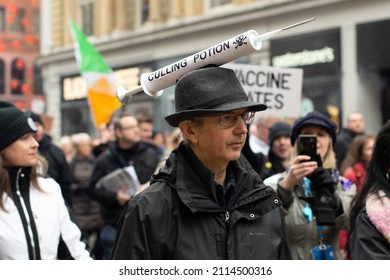 Manchester UK. January 22, 2022. Anti Vax Protest Deansgate. Protester With Syringe On Trilby Hat Text Culling Potion