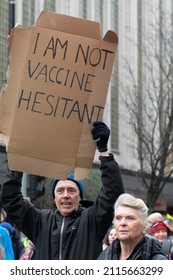 Manchester UK. January 22, 2022. Anti Vax Protest Deansgate. Protester With Sign Text I Am Not Vaccine Hesitant