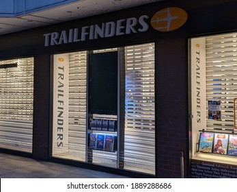 Manchester UK.  January 6, 2021. Trailfinders Travel Agent Closed During National Lockdown In England. Shutters Down And Lights On.