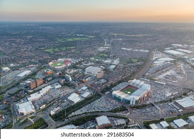 Manchester, UK - July 2014 - Twilight aerial view over western Manchester with Old Trafford Football and Cricket Ground in the foreground.. Image shot 2013. Exact date unknown.