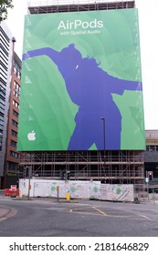 Manchester UK. July 23, 2022. Advert For Apple Air Pods. Text Spatial Audio. Construction Site With Scaffolding.