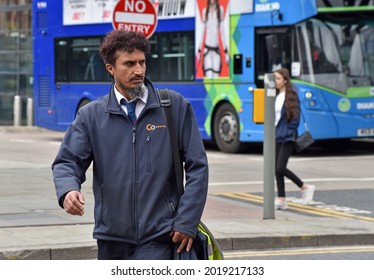 Manchester, UK - July 7th 2021: Bus Driver Walking Away From The Bus Station In Central Manchester