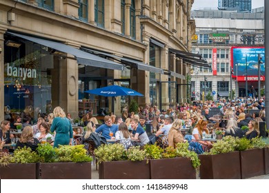 Manchester, UK - June 1 2019: Busy And Popular Outdoor Restaurants With People Eating And Drinking In Manchester City Centre