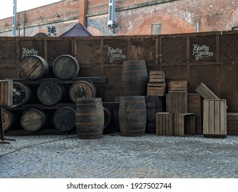 Manchester, UK. March 1, 2021. Film set for Peaky Blinders period drama at Castlefield heritage site with barrels and sign for Shelby Haulage Limited