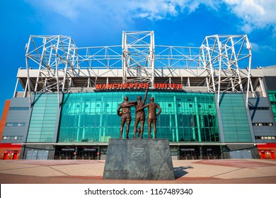 MANCHESTER, UK - MAY 19 2018: The United Trinity bronze sculpture which composed with George Best, Denis Law and Sir Bobby Charlton in front of Old Trafford stadium