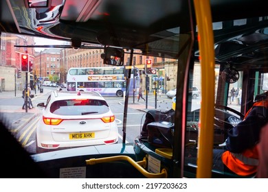 Manchester, UK - Nov 2016: View Of Road Traffic And Pedestrian Crossing From Inside Of Bus Windshield Glass Window.