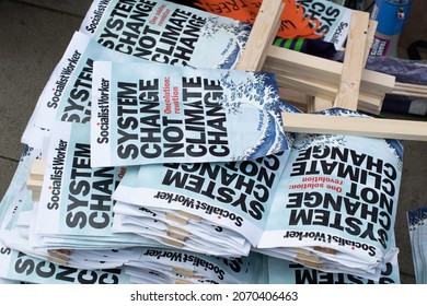 Manchester UK, November 6, 2021. COP 26 Climate Change Protest In St Peter's Square. Pile Of Placards Text System Change Not Climate Change.