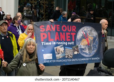 Manchester UK, November 6, 2021. COP 26 Climate Change Protest In St Peter's Square. Protester With Banner Text Save Our Planet.