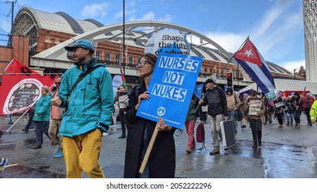 Manchester UK. October 3, 2021. Tory Party Conference Protest Marching In Front Of Manchester Central Conference Venue With Sign Text Nurses Not Nukes And Campaign For Nuclear Disarmament.