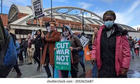 Manchester UK. October 3, 2021. Tory Party Conference Protest Marching In Front Of Manchester Central Conference Venue With Sign Text Cut War Not Welfare