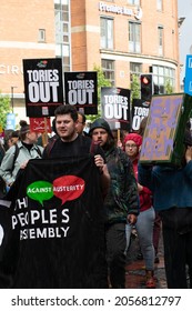 Manchester UK. October 3, 2021. Tory Party Conference. Peoples Assembly Against Austerity Protest Marching With Sign Text Tories Out