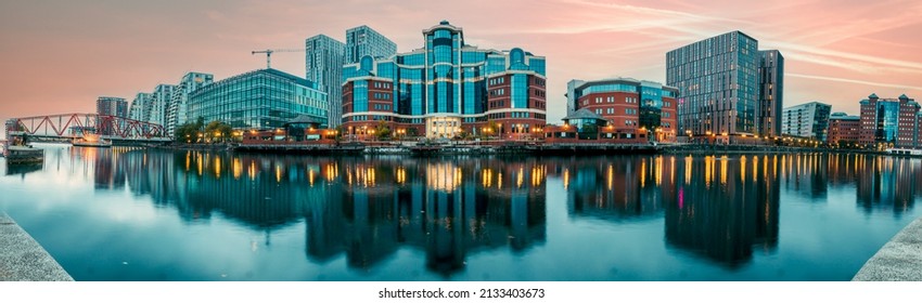 Manchester, UK. September 15, 2021: View on the river bridge of Manchester Ship Canal in Salford and Trafford, MediaCityUK buildings and facilities.