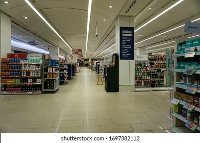 Manchester, UK-March 22, 2020: A Deserted Pharmacy Store In The Armadale Centre Of Manchester UK During Coronavirus COVID-19 Lockdown Showing Stocked Shelves But No People￼￼