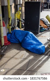 Manchester, United Kingdom - 11th Oct 2020: Homeless Person Sleeping In A Sleeping Bag On The Street In City Centre Manchester.