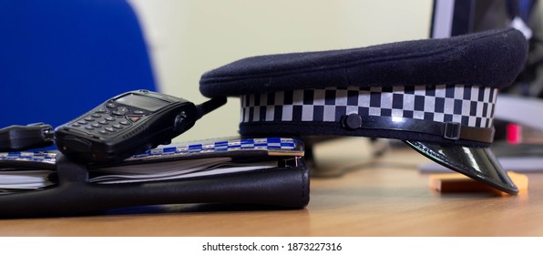 Manchester, United Kingdom - 12th  Dec 2020: British Police Officer Equipment Sat On An Office Desk.